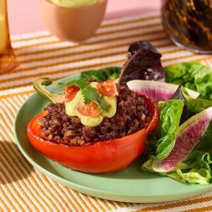 Walnut Chorizo Stuffed Bell Peppers with Avocado Crema