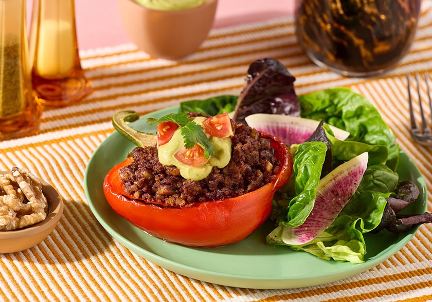 Walnut Chorizo Stuffed Bell Peppers with Avocado Crema