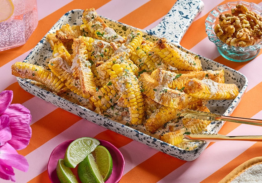 Smoked Paprika-Spiced Corn Ribs with Walnut Parmesan and Walnut Lime Crema
